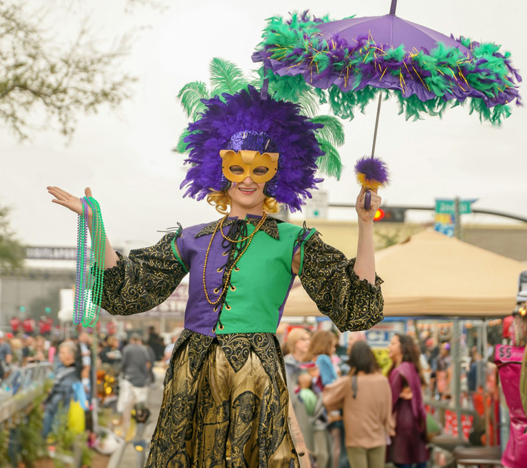 a woman in a costume holding an umbrella at The  Sutton